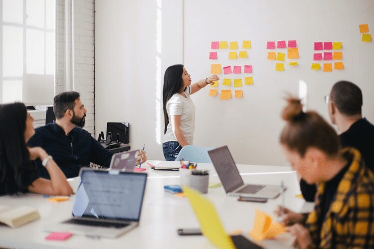  A product manager speaking with her team.